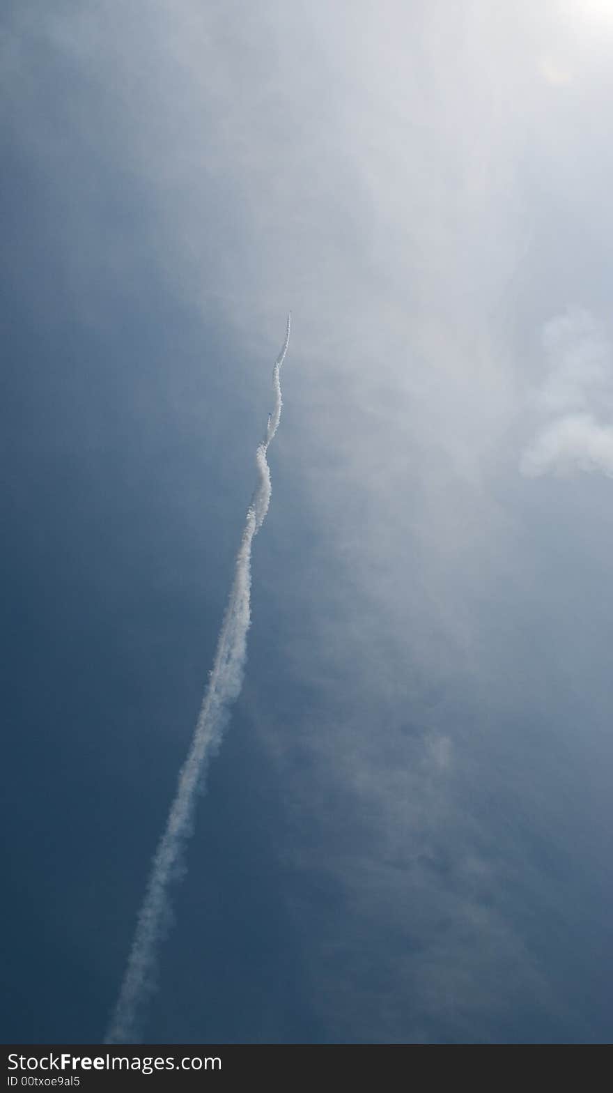 Smoke from plane flying into sky