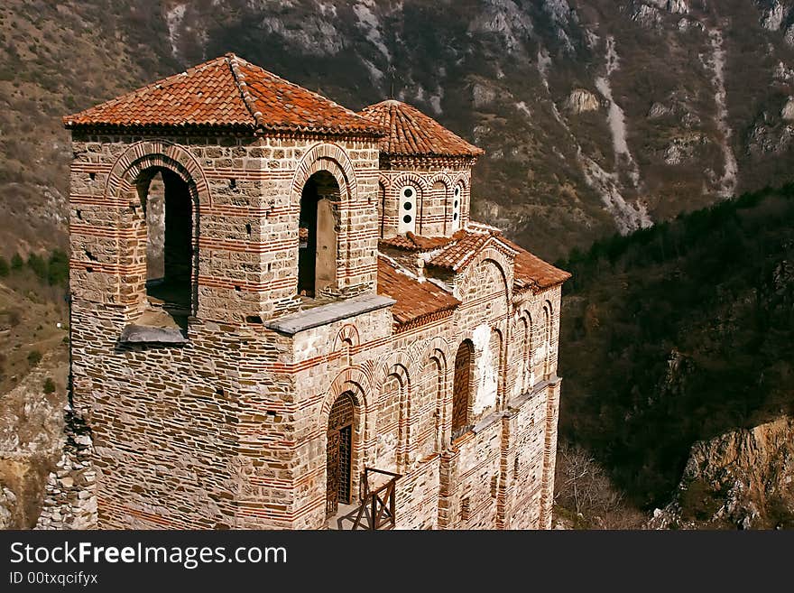 Old antique ortodox church in mountains with trees. Old antique ortodox church in mountains with trees