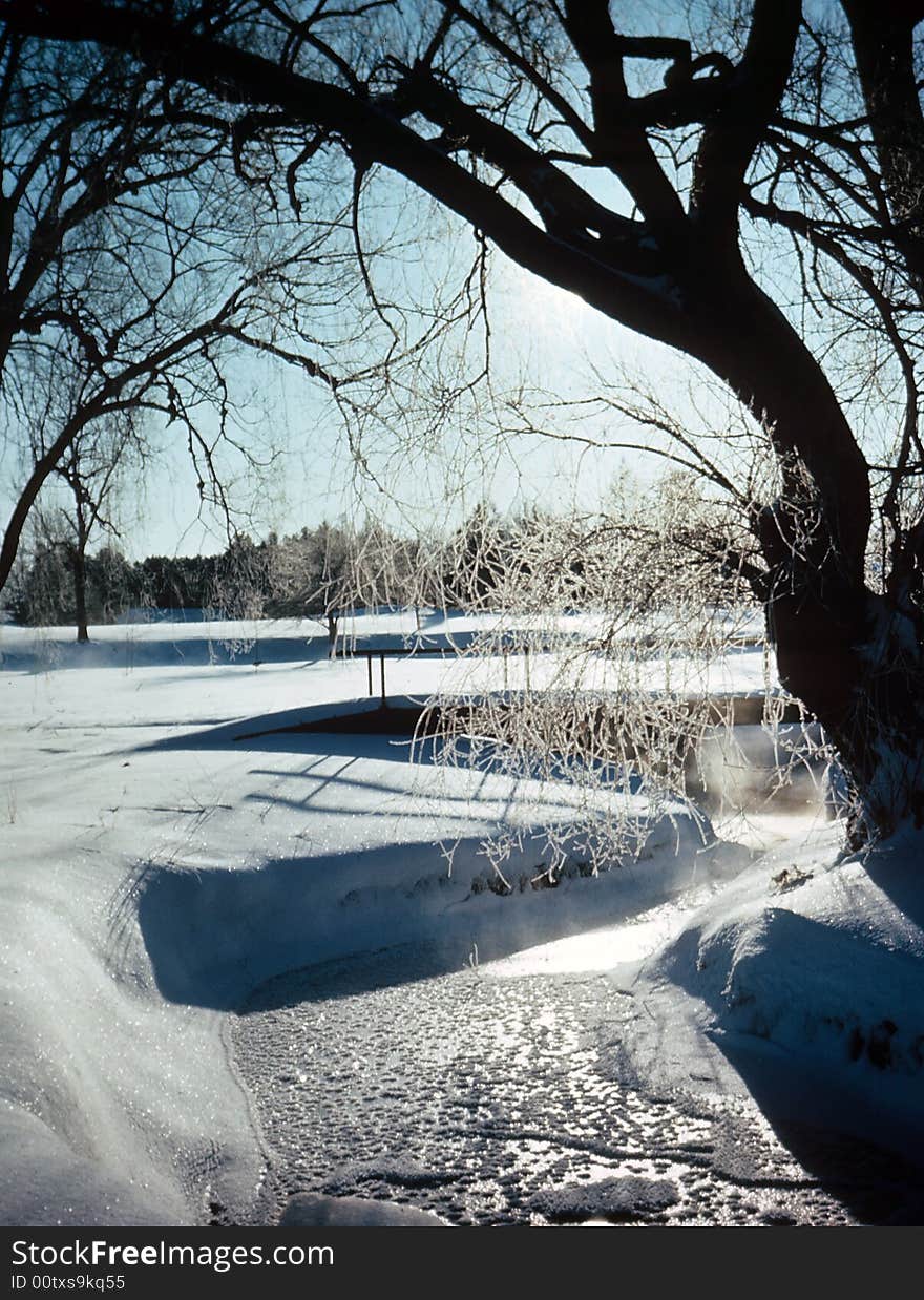 A creek frozen over in the winter months. A creek frozen over in the winter months