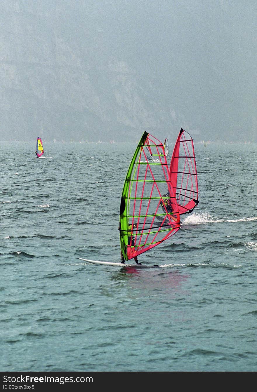 Two wind surfers on Lake Garda, Italy. Two wind surfers on Lake Garda, Italy.