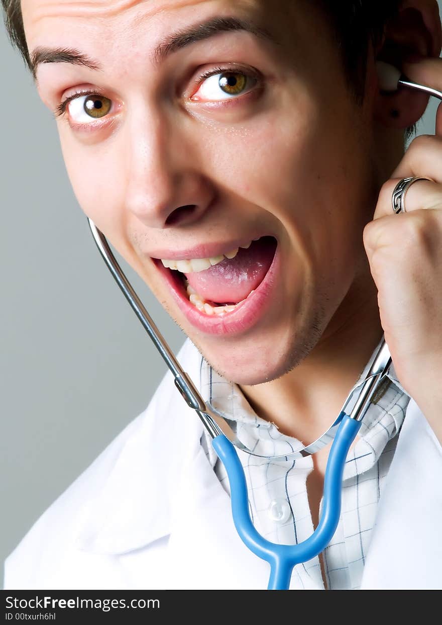 Happy young doctor with a stethoscope