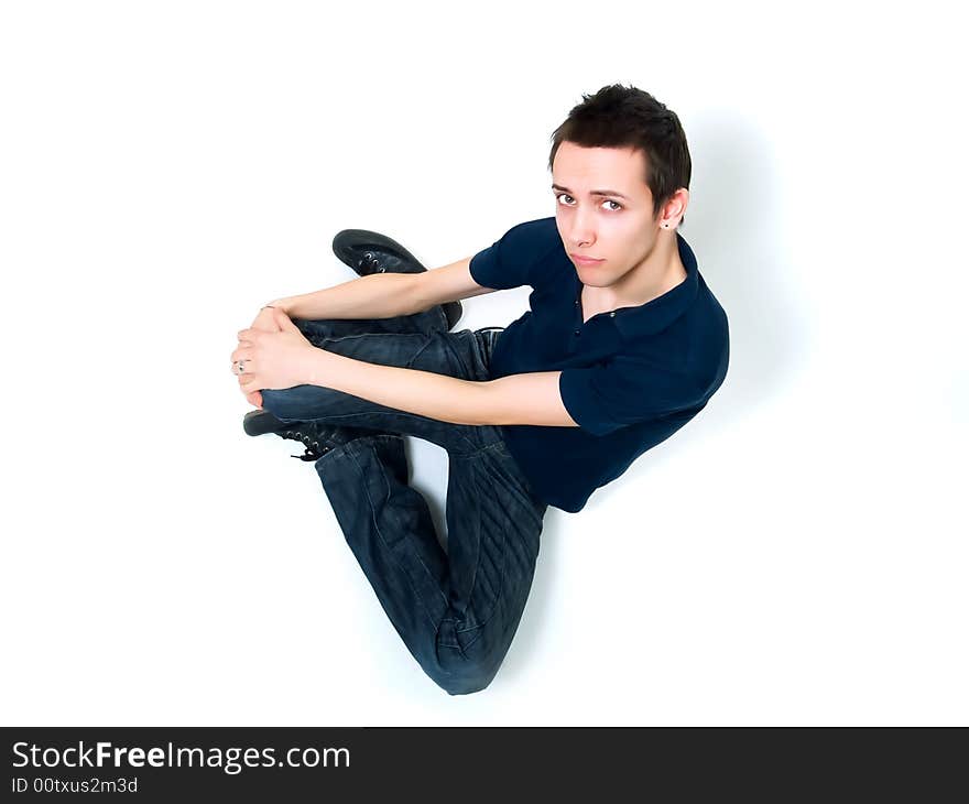 Happy young man posing on a white background