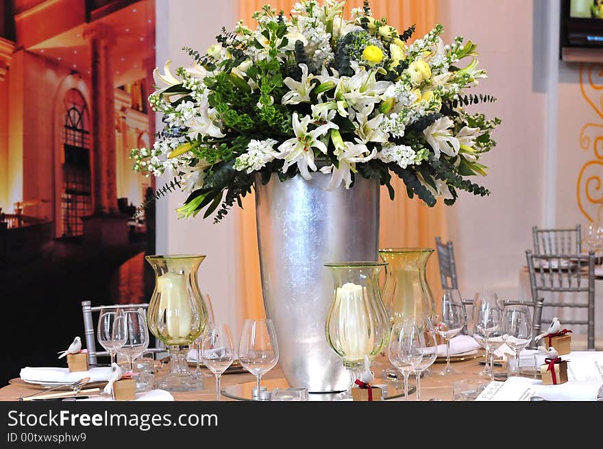 White flower  lily bottle glass table. White flower  lily bottle glass table