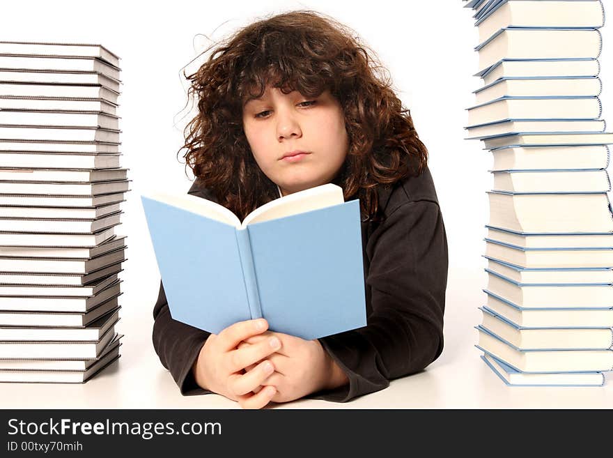 Boy reading a book and many books on white background