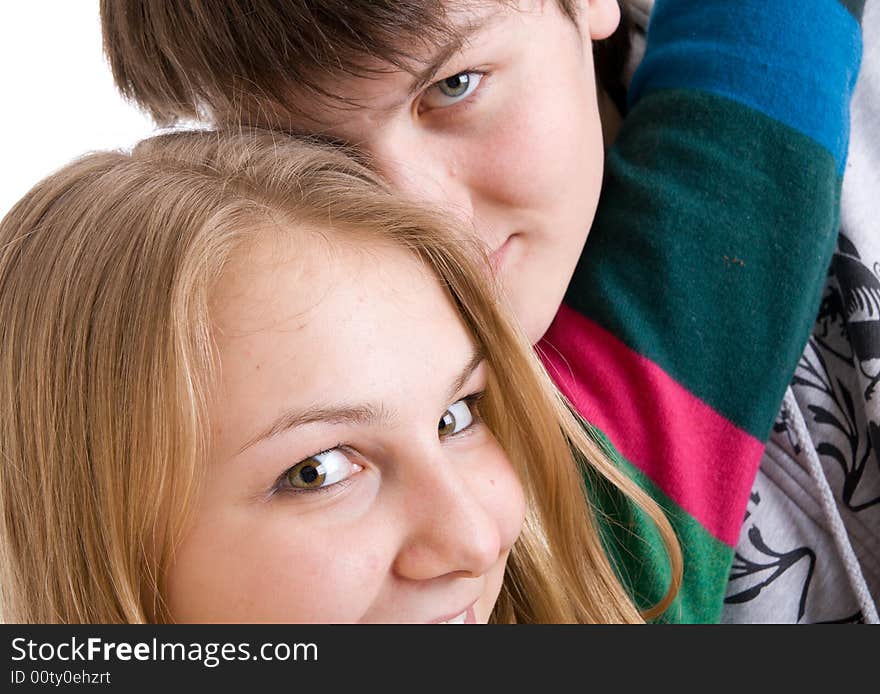 Young embracing pair isolated on a white background