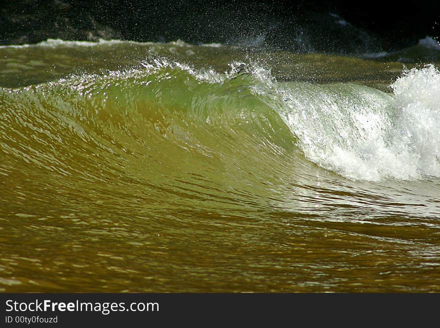 An image of a perfect wave in the beach