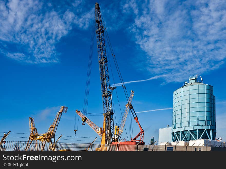 Cranes in a building area near Piombino Harbour, Tuscany, Italy.