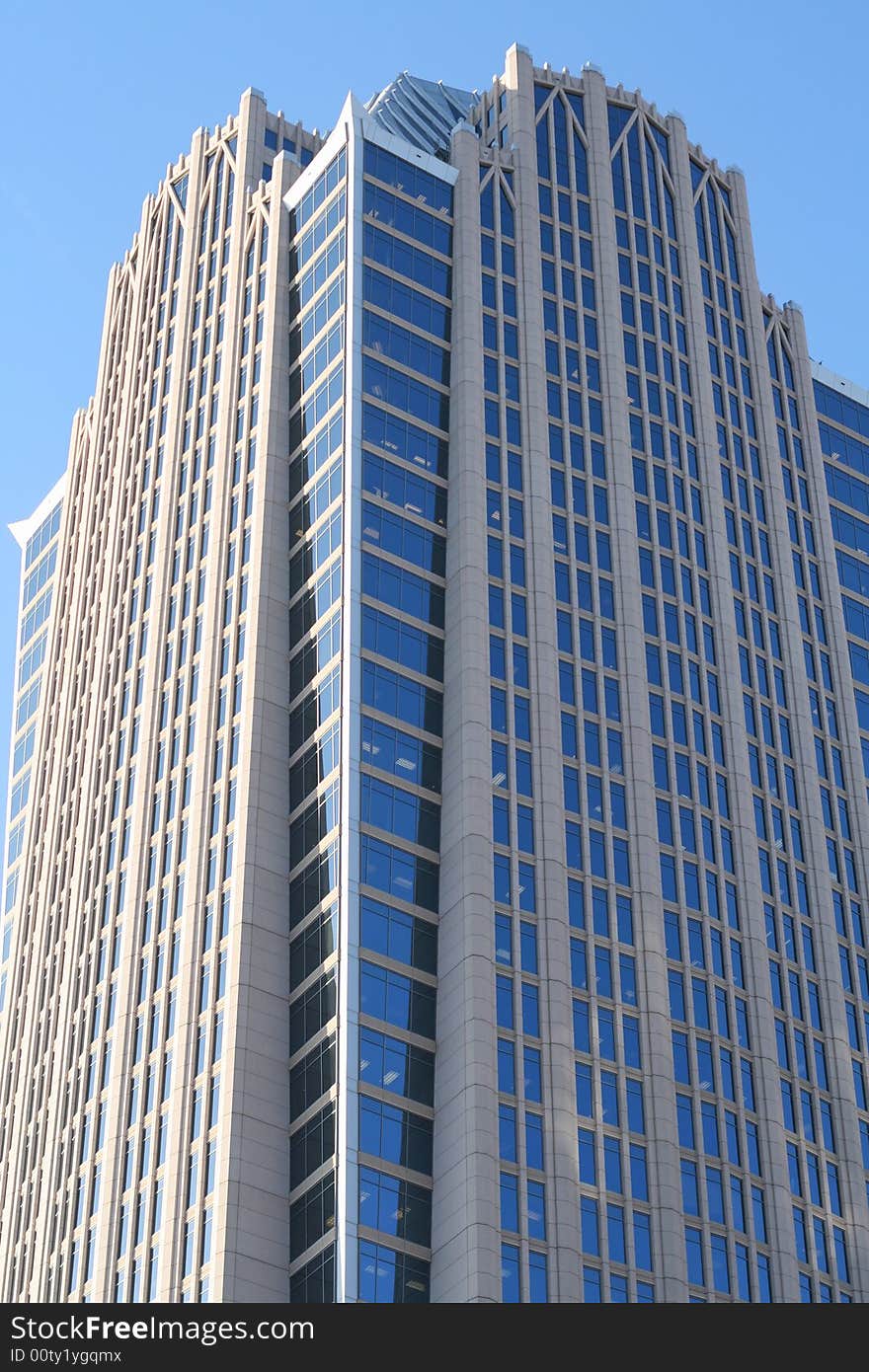 City skyscraper against a blue sky. City skyscraper against a blue sky