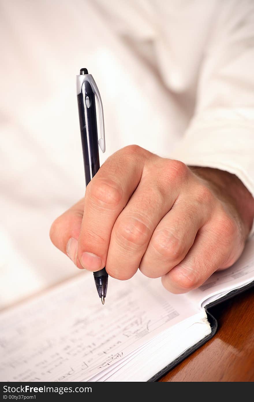 Close-up of businessman with pen