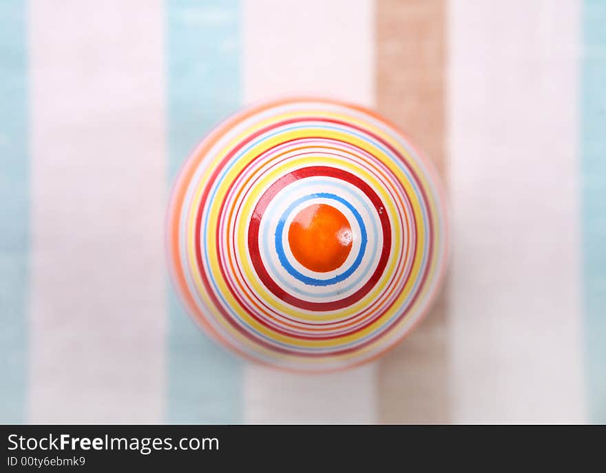 Striped egg on striped cloth - easter decoration