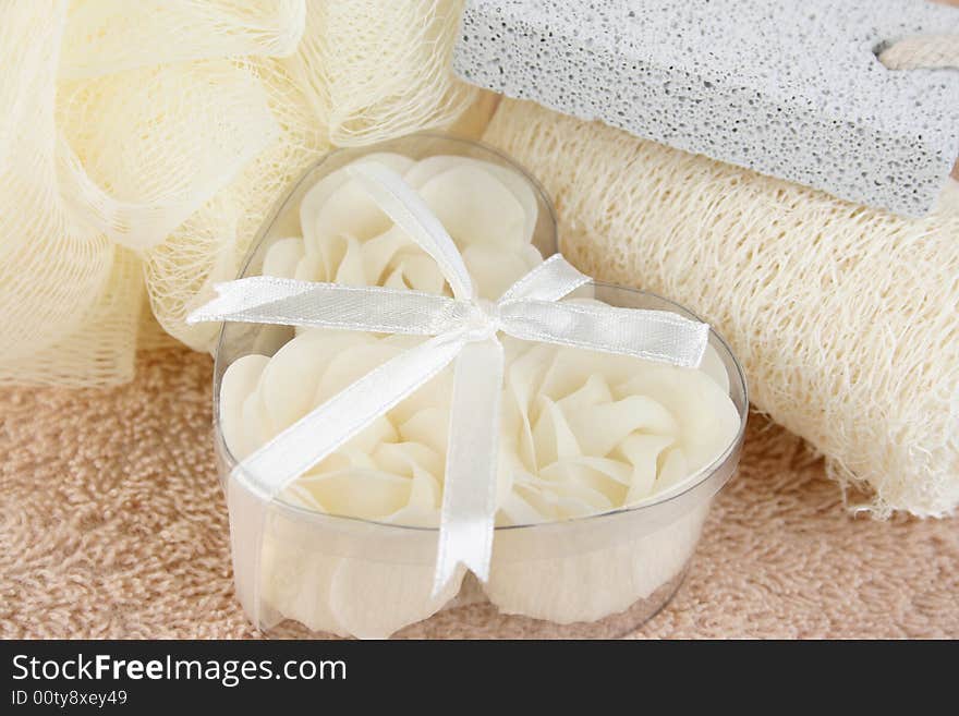 White soap flowers in heart box and bath sponges. White soap flowers in heart box and bath sponges