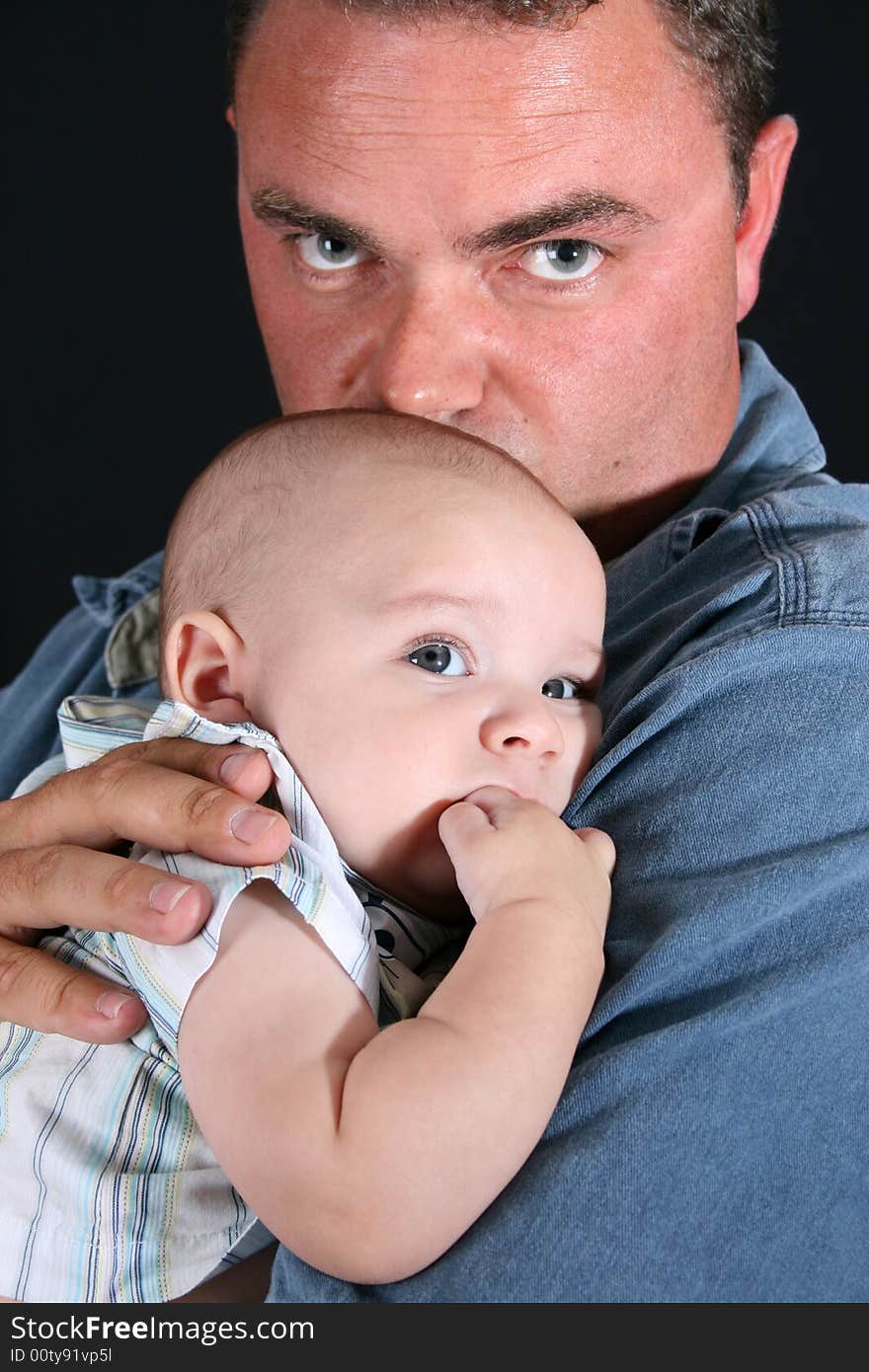 Father and Baby boy on a black background. Father and Baby boy on a black background