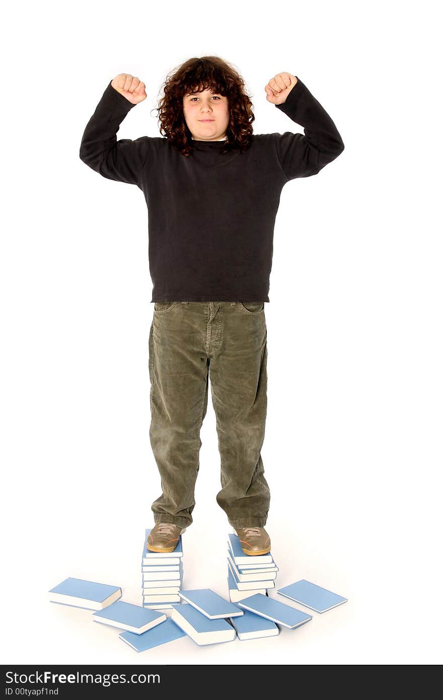 Boy on stack of books on white background