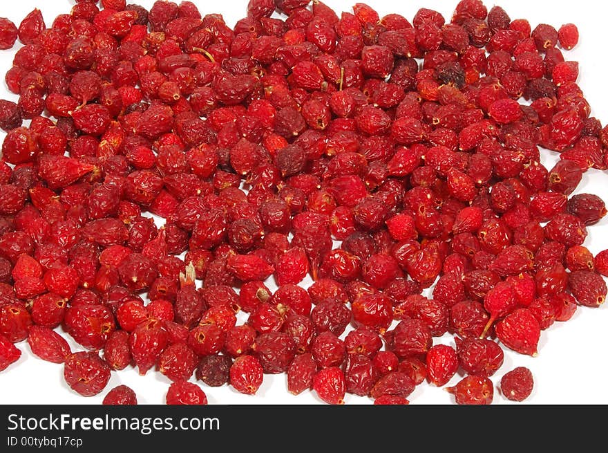 Tasty ripe red hips on white background. Tasty ripe red hips on white background