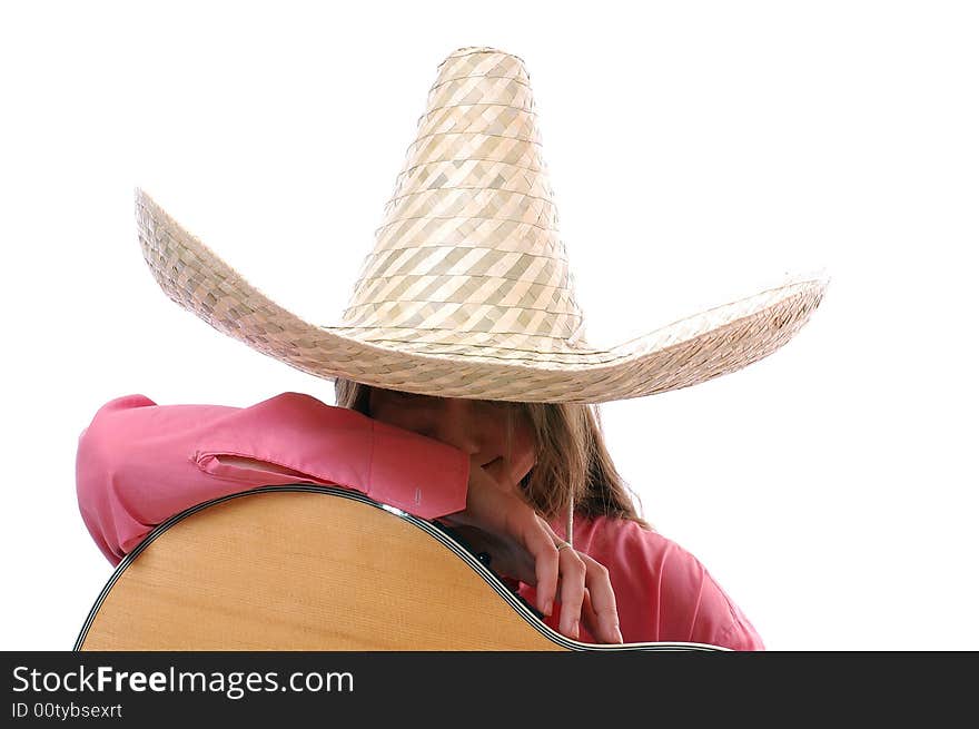 Pretty woman in large cowboy hat sitting with guitar, white background. Pretty woman in large cowboy hat sitting with guitar, white background