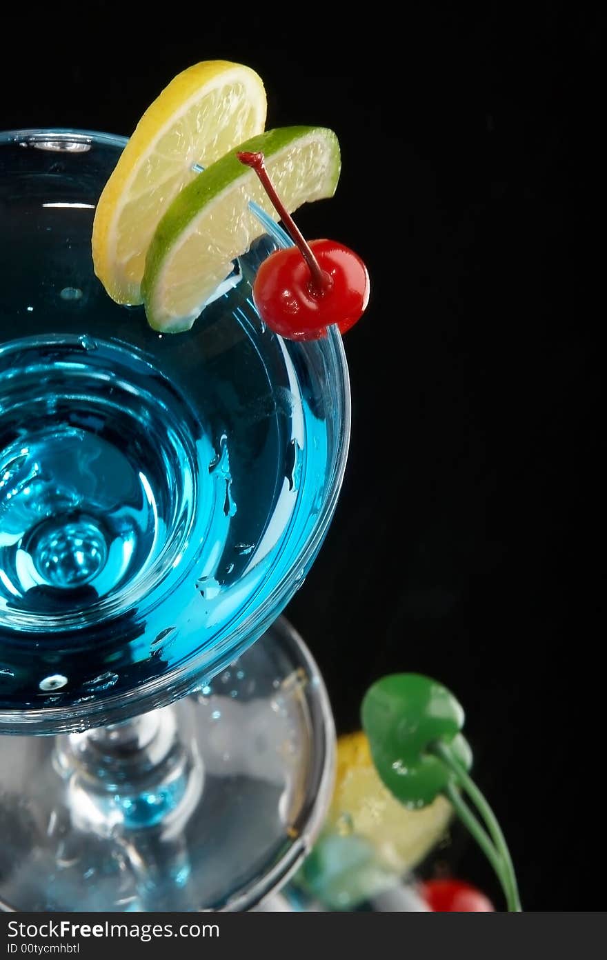 Still life with glass with drink on the black background