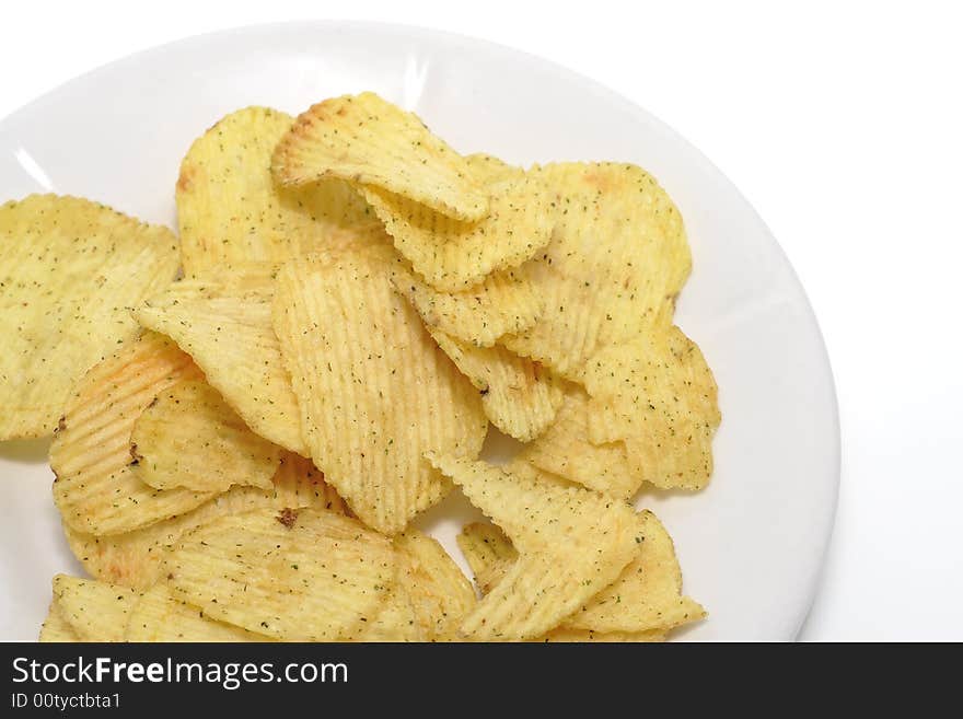 A lot of chips on a plate. Top view