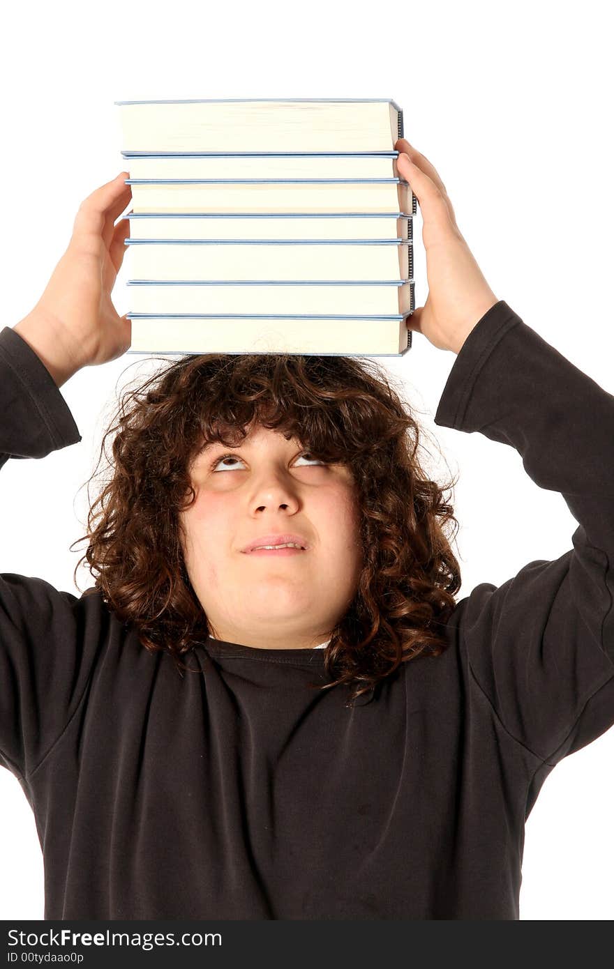 Boy with books on head on white background