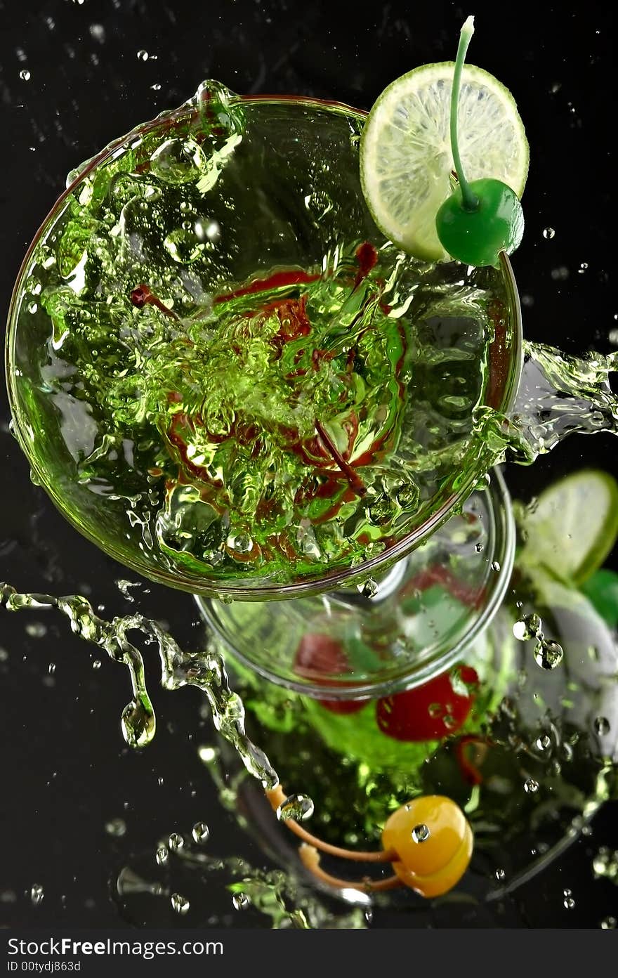 Still life with glass with drink on the black background