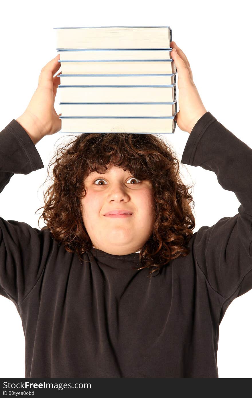 Boy with books on head on white background