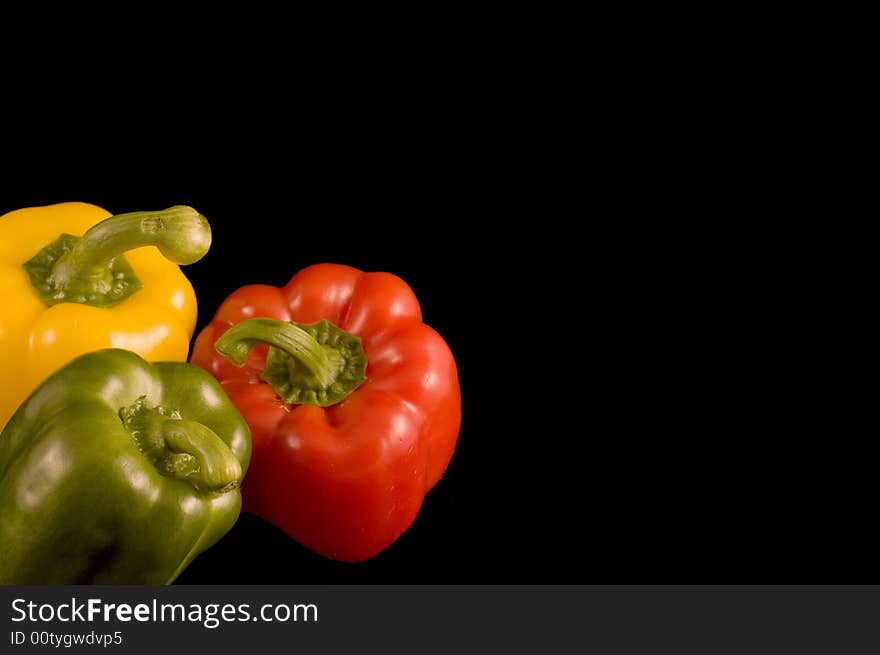 Bell Peppers On A Black Background