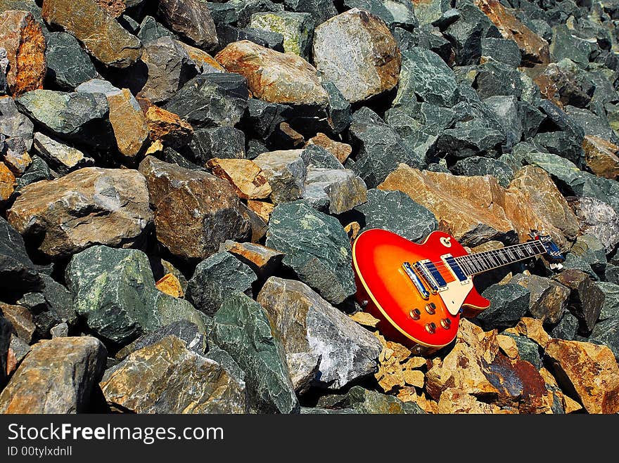 Vintage Electric Guitar on the Rocks