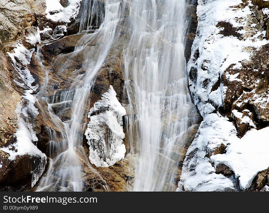 Mountain frozen waterfall, winter season, horizontal orientation