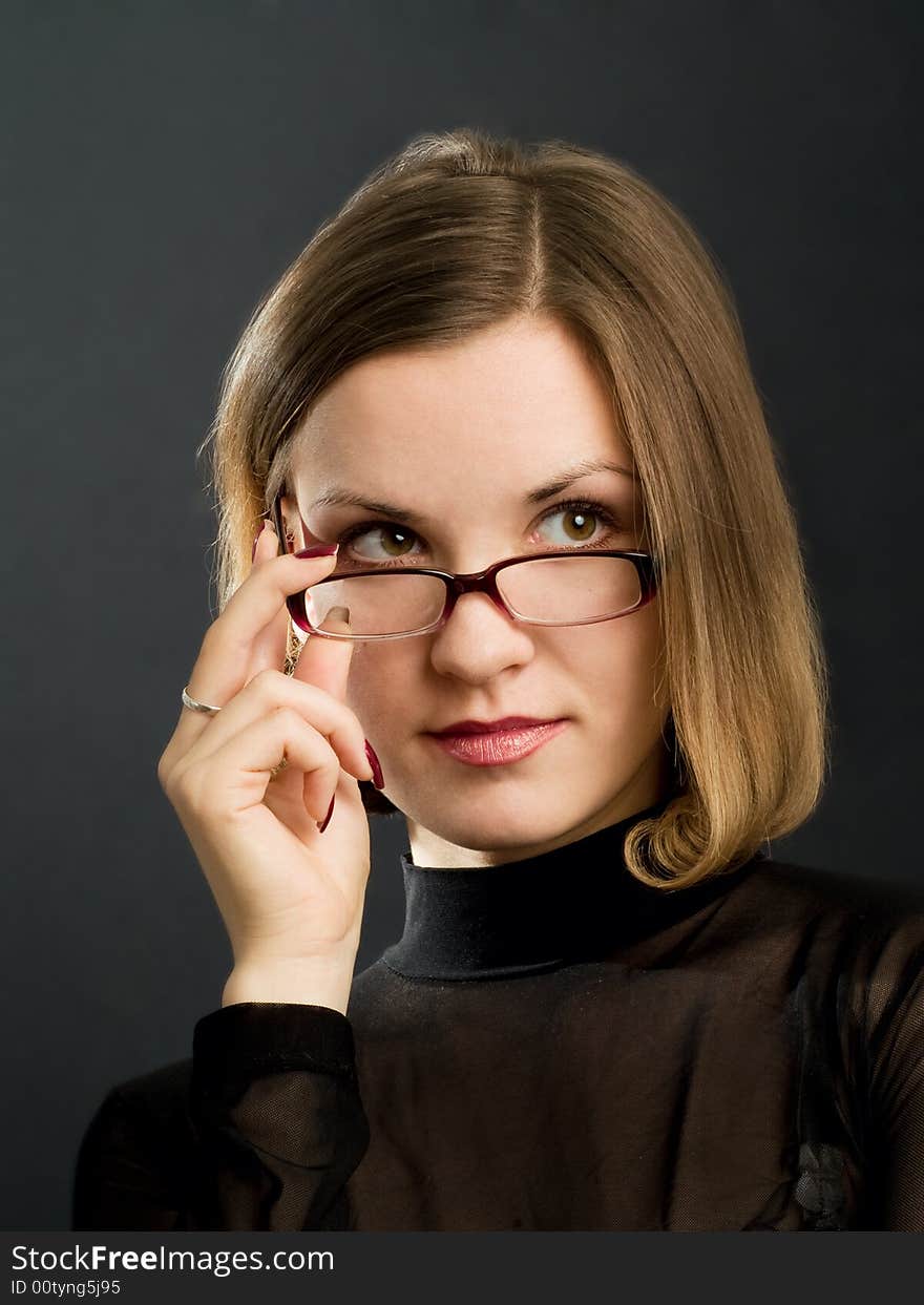 Portrait of girl with hand near glasses. Portrait of girl with hand near glasses