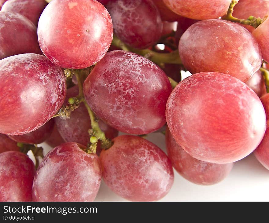 Fresh red grapes isolated on white background