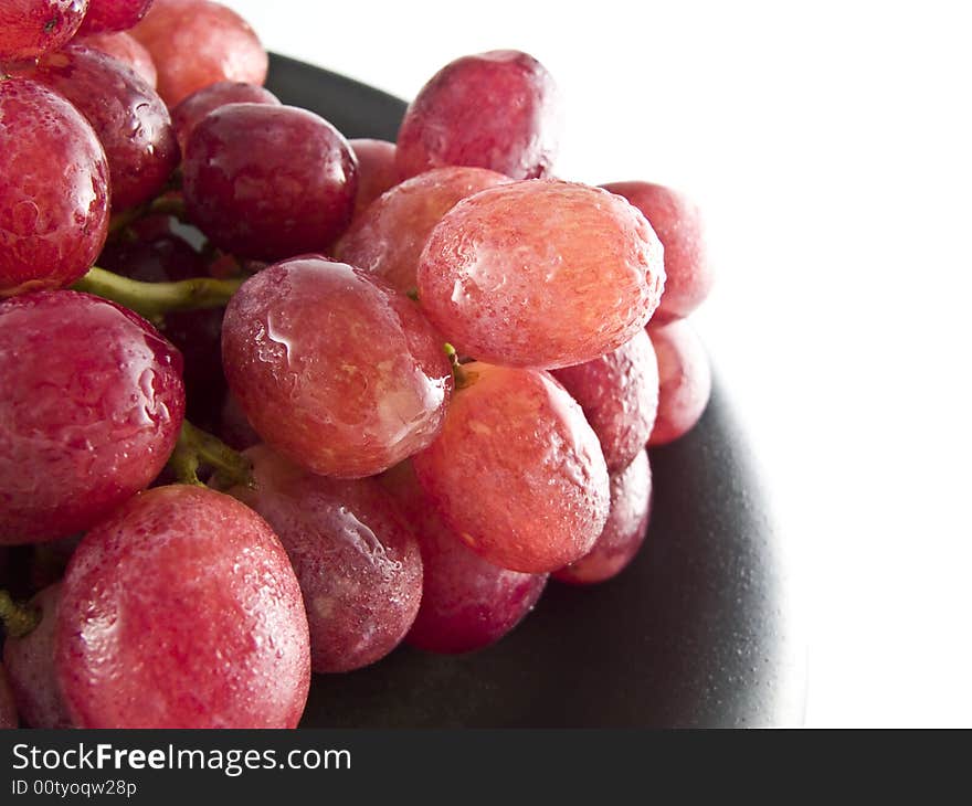 Fresh red grapes isolated on white background