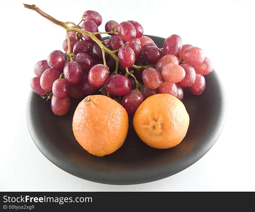 Grapes and mandarines isolated on white background. Grapes and mandarines isolated on white background