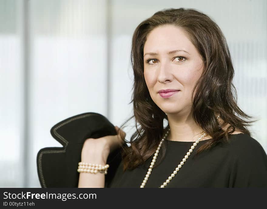 Confident Hispanic Woman Wearing pearls