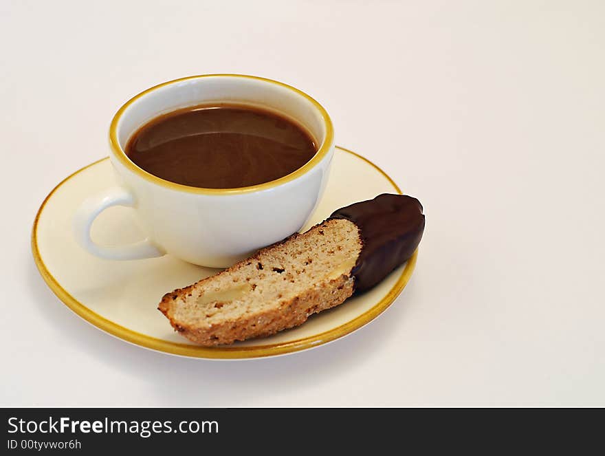 Time out for walnut biscotti dipped in a cup of espresso coffee. Time out for walnut biscotti dipped in a cup of espresso coffee.