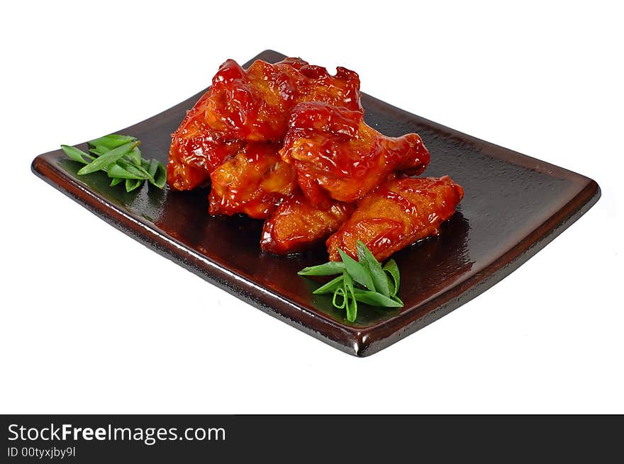 Meat of the hen on a dish on a white background