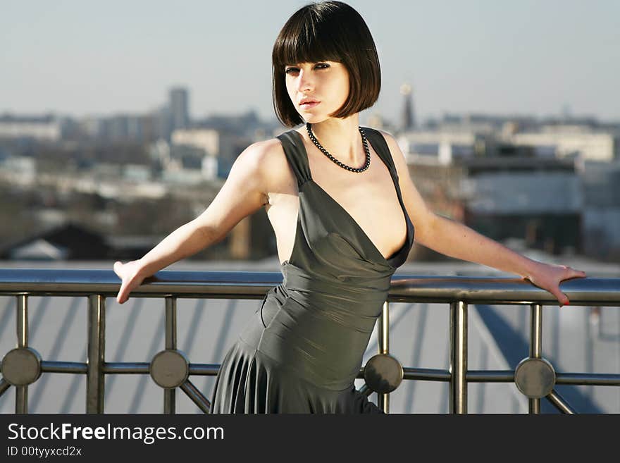 Portrait of a young sexy girl on the roof of the building. Portrait of a young sexy girl on the roof of the building