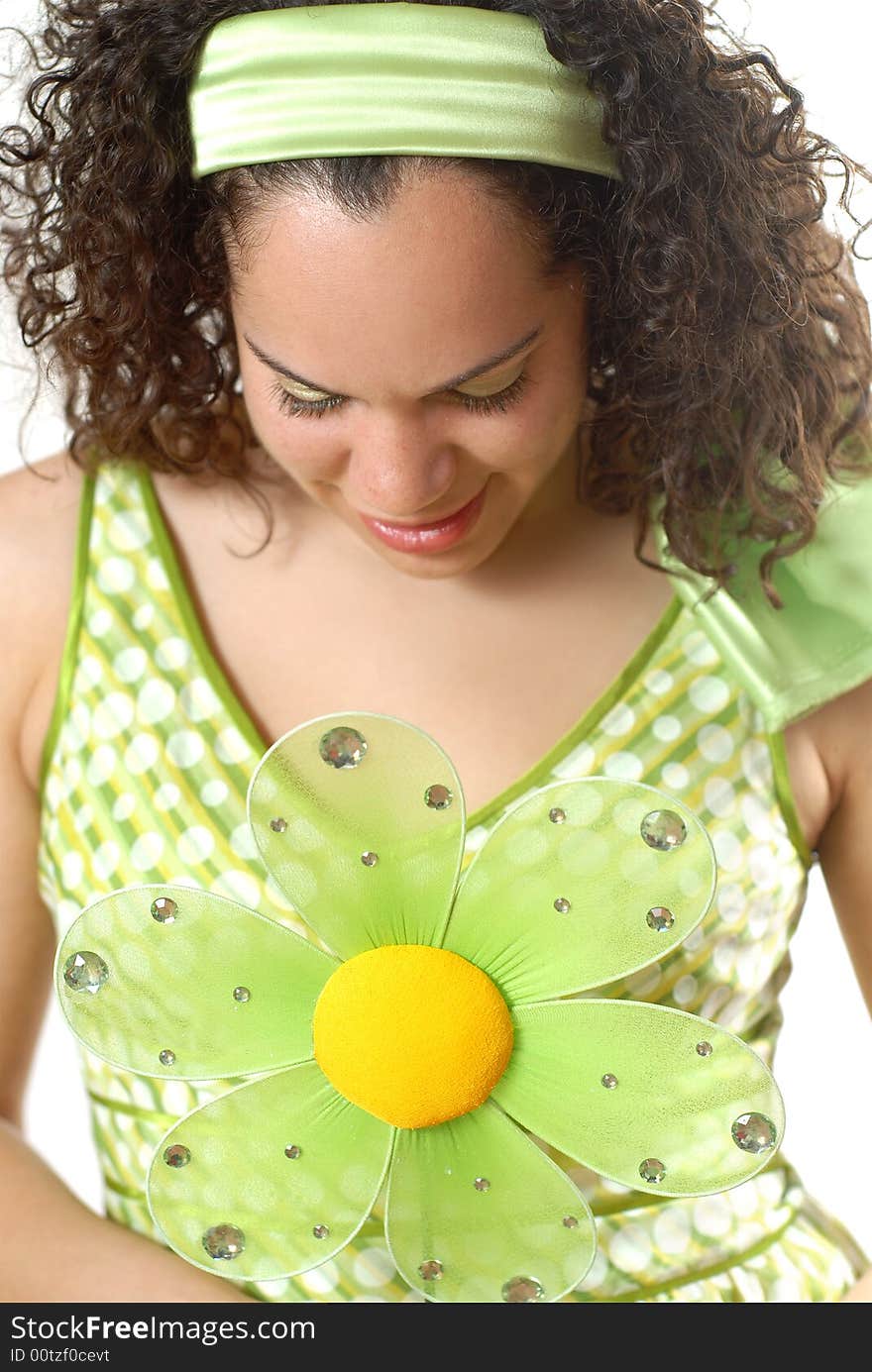 Young teen dressed in a fun polka dot spring dress with a flower. Young teen dressed in a fun polka dot spring dress with a flower