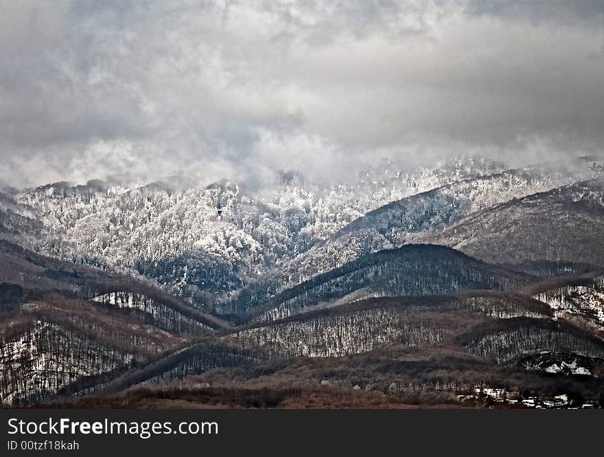 Mountain in winter with snow and clouds. Mountain in winter with snow and clouds