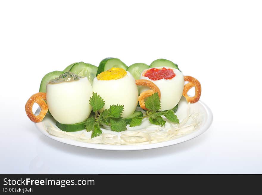 Stuffed eggs with tomato, spinach and cucumbers