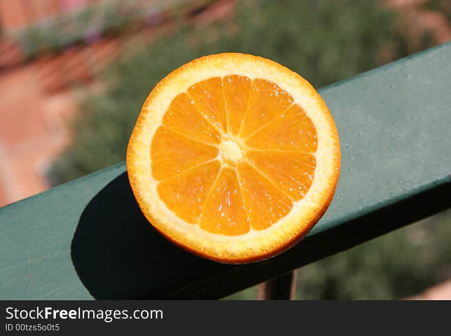 A juicy orange outside on the balcony