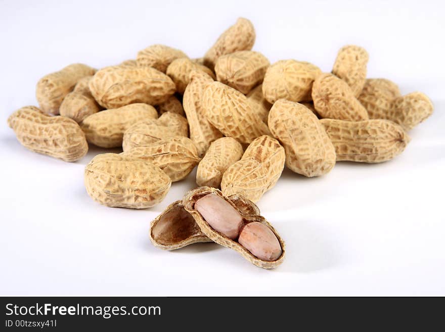 Pile of peanuts isolated on white background. Pile of peanuts isolated on white background