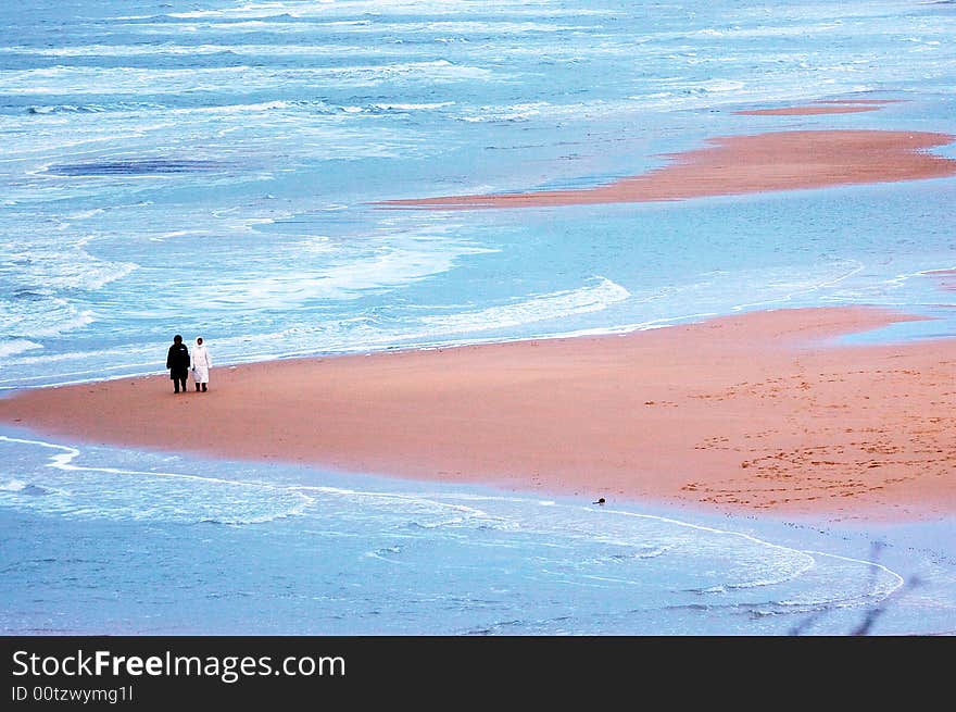 Take a walk a pair of the sweethearts seashore in winter. Take a walk a pair of the sweethearts seashore in winter