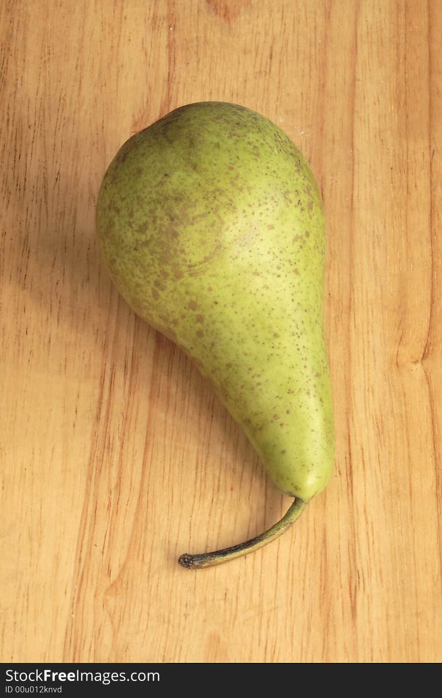 Conference pear on a wooden board