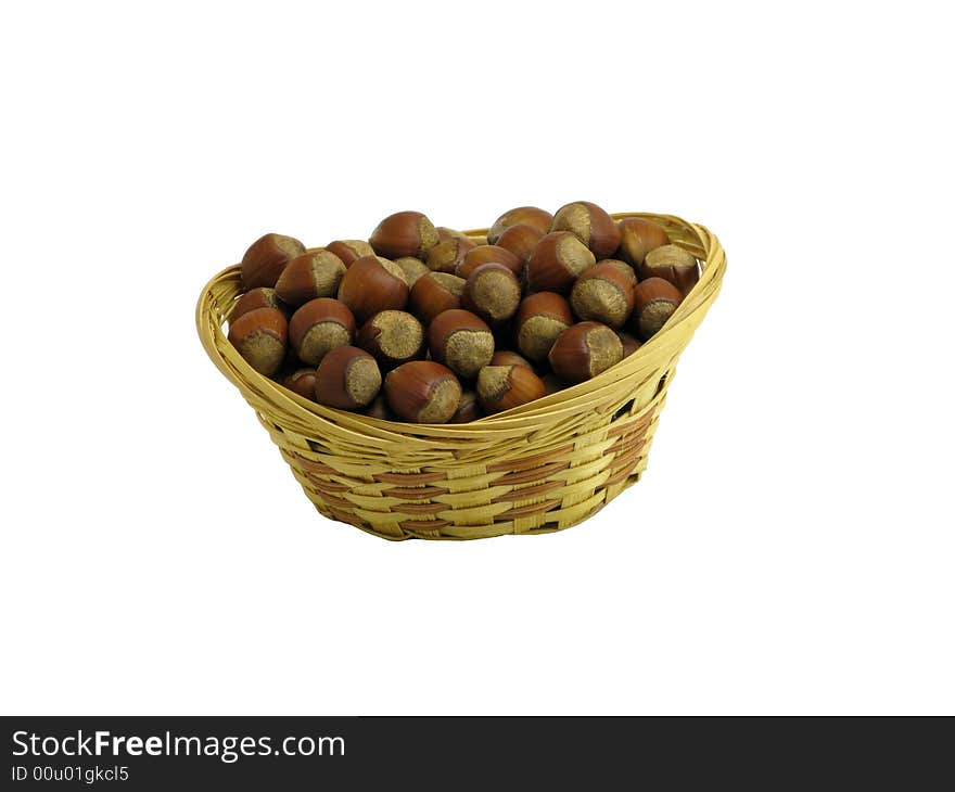 Nuts in wattled basket isolated on white. Nuts in wattled basket isolated on white