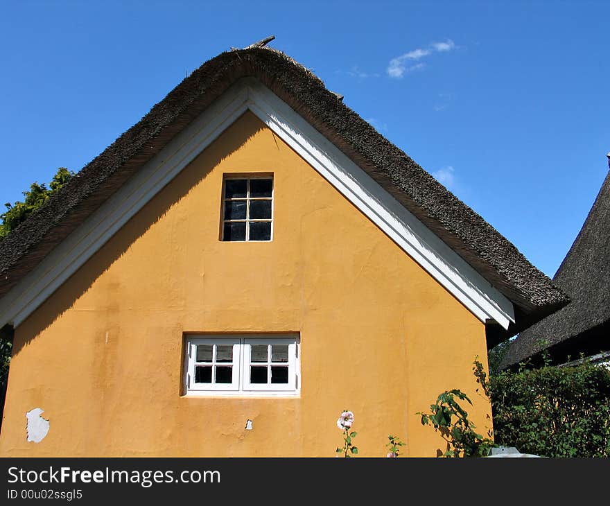 Typical country house with old style thatched straw roof in Denmark. Typical country house with old style thatched straw roof in Denmark