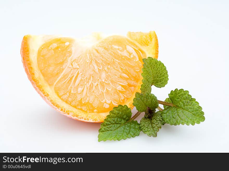 Frozen orange with fresh balm, isolated