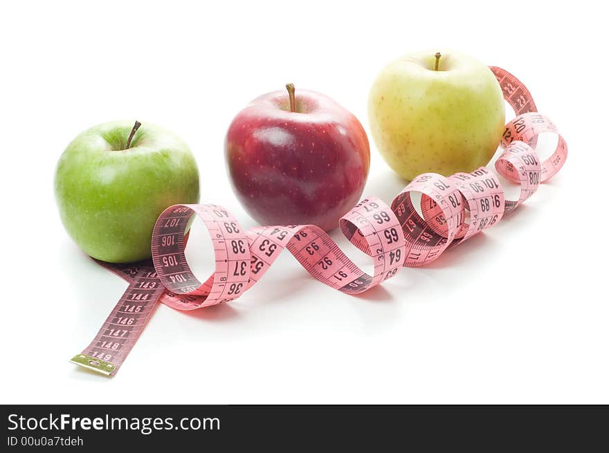 Apples and tape measure isolated on a white background