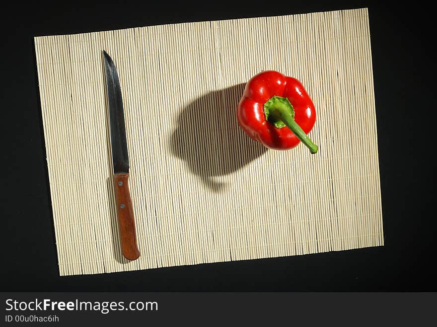 Red bell pepper and knife