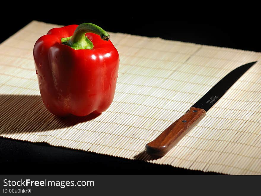 Red bell pepper and knife