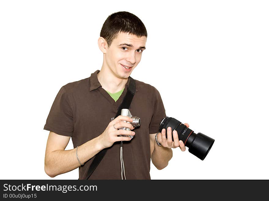 The photographer tries on an objective to a camera