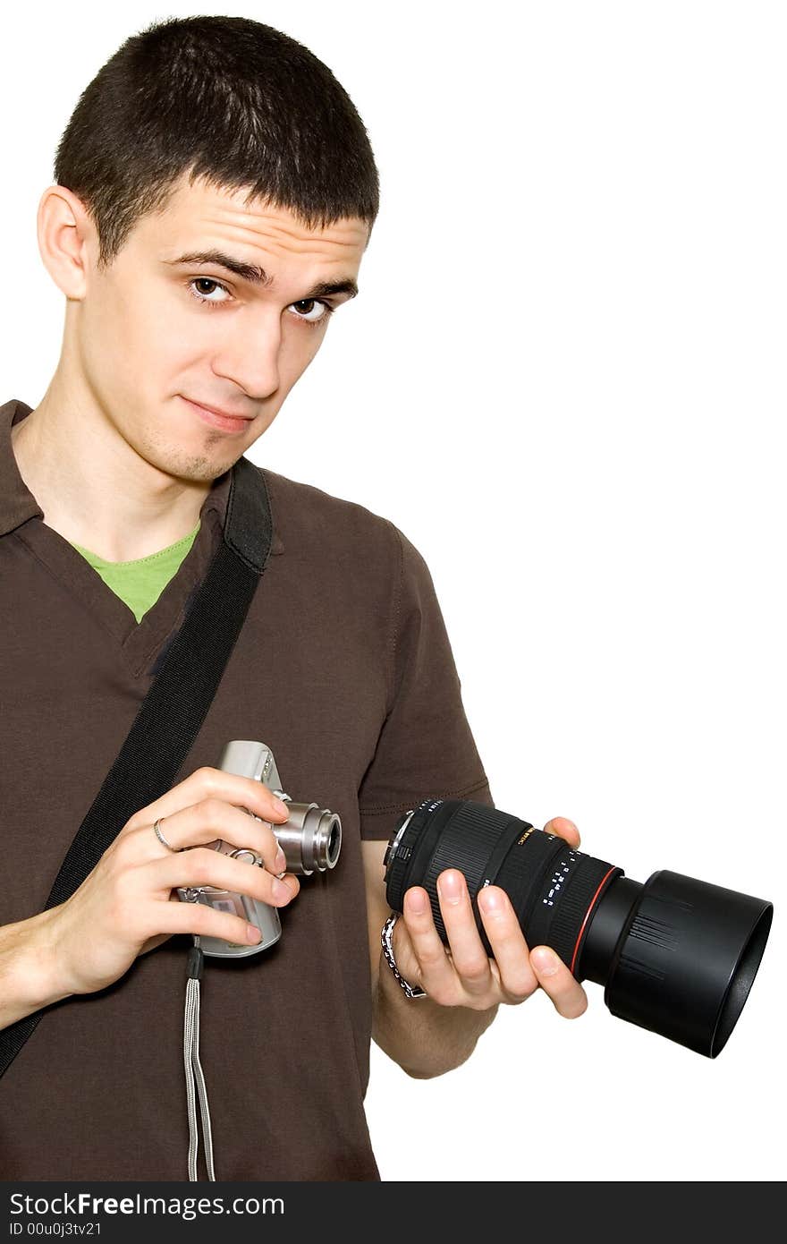 The photographer tries on an objective to a camera